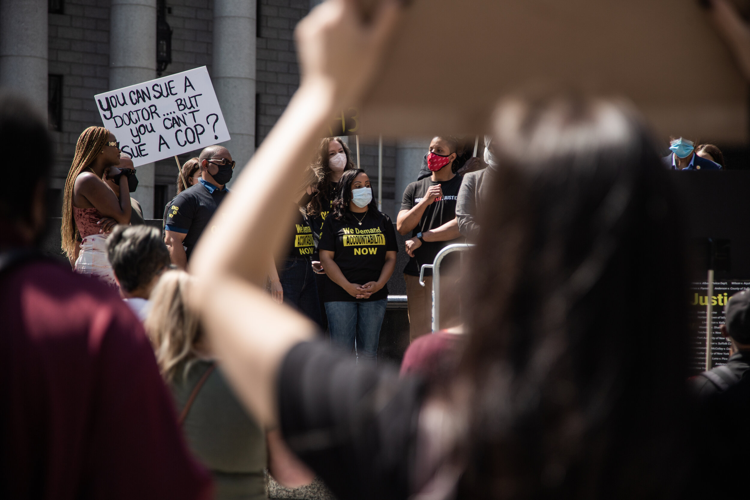  Darlene McDay listens to the families of people who have been impacted by the justice system during a rally to end qualified immunity on May 21, 2021. 
