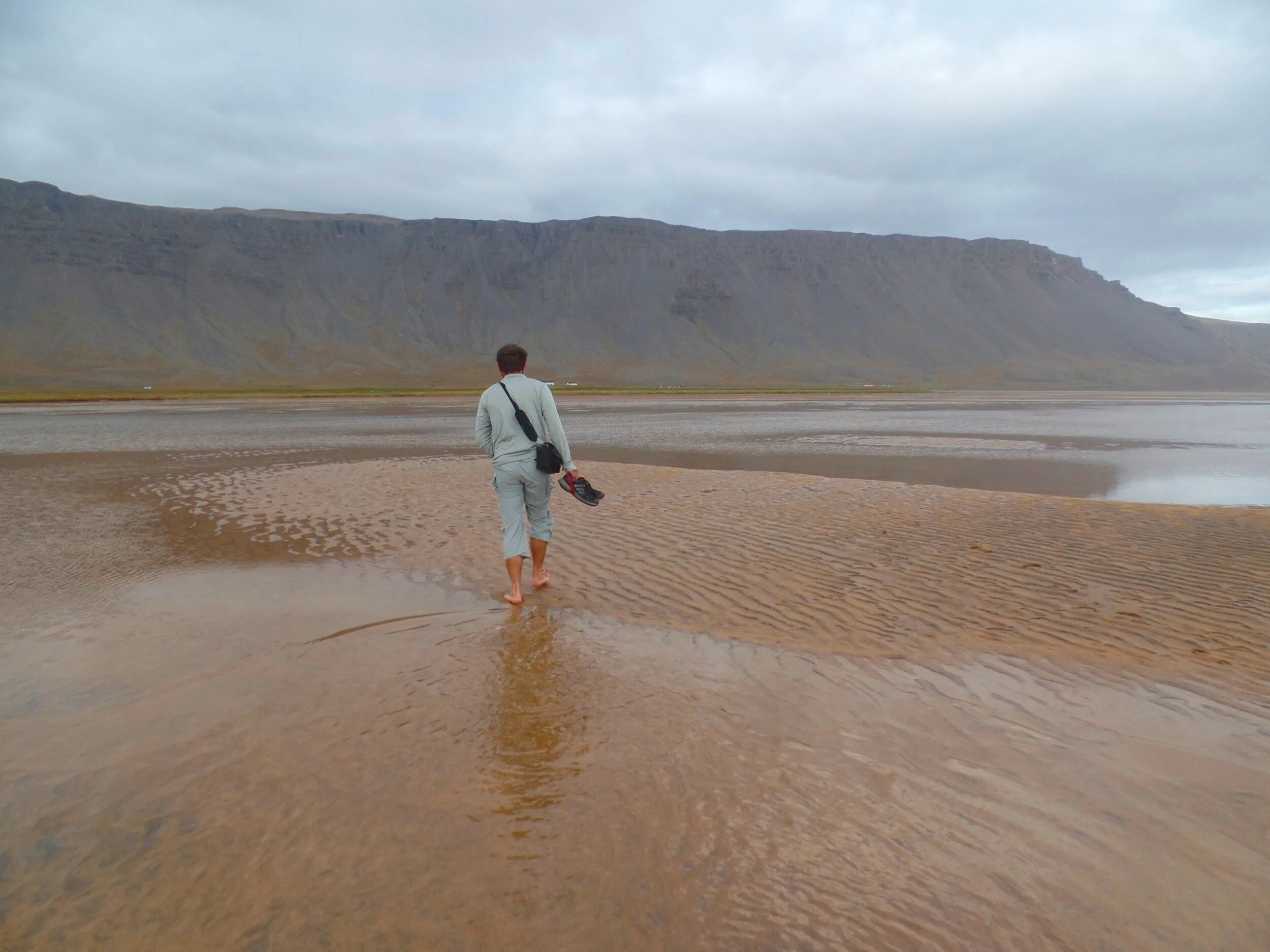 visit red sand beach raudasandur west fjords iceland