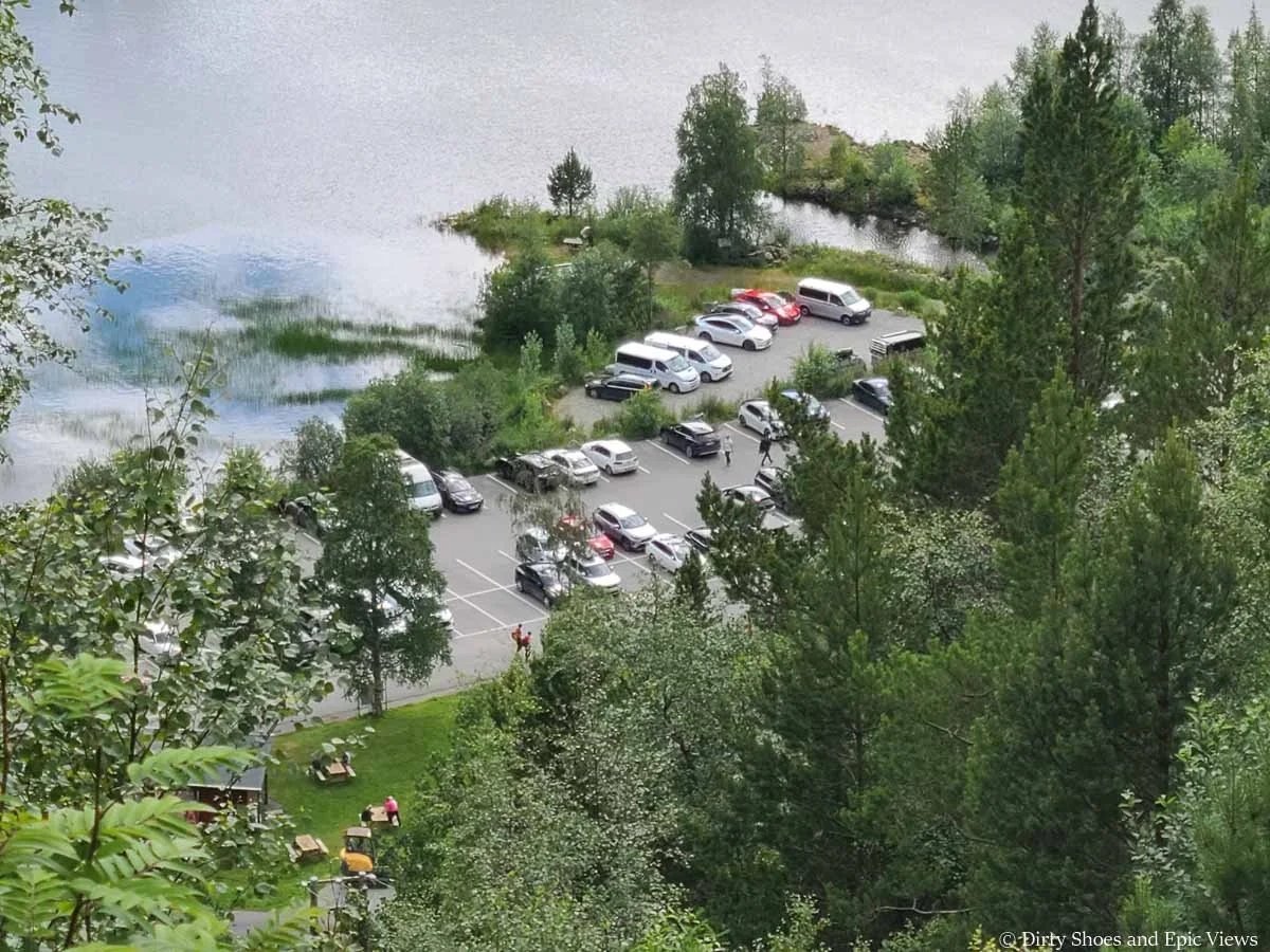 Cars are parked in a small lot near the Trolltunga hike in Norway