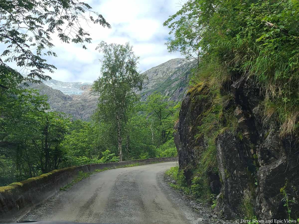 A narrow road makes a blind turn on the way to the Reinanuten trailhead in Norway