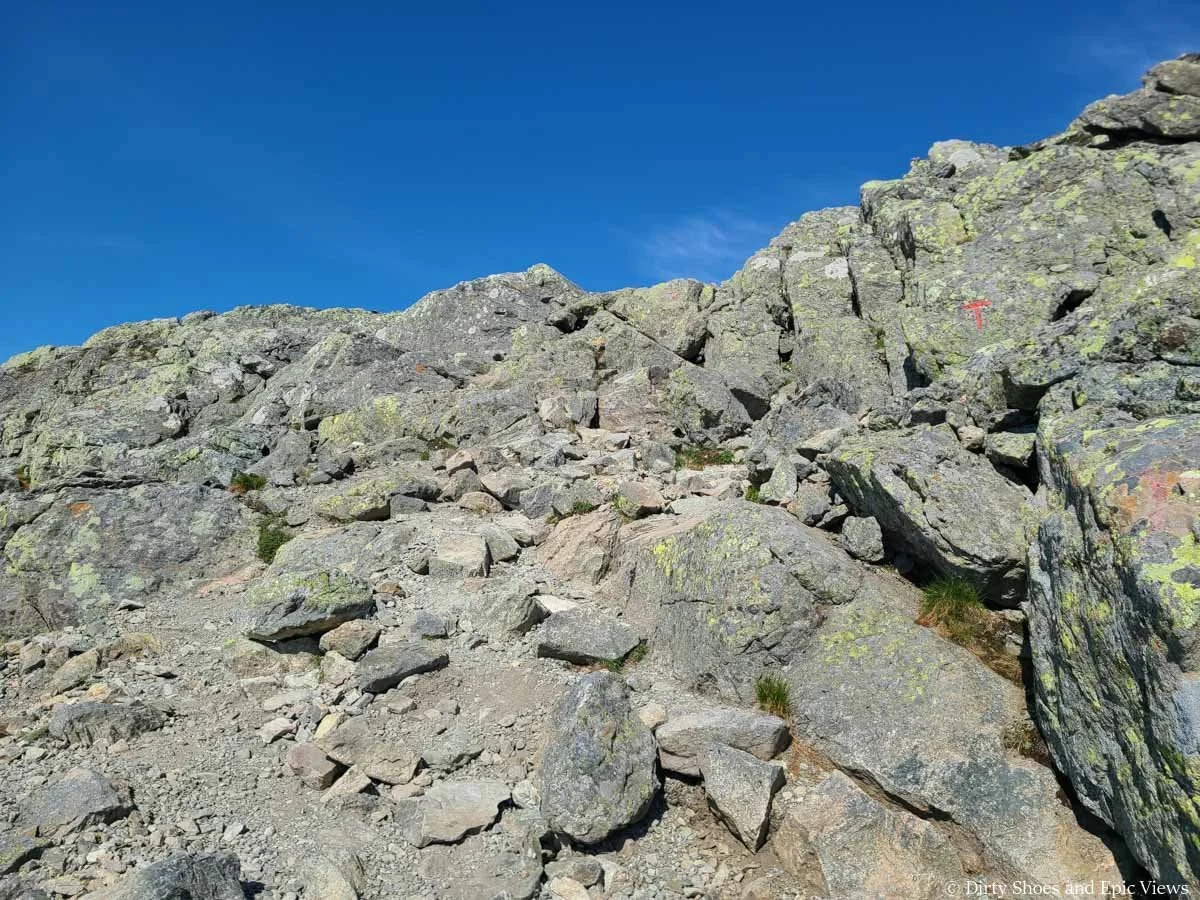 A trail weaves up a rocky landscape on the Besseggen Ridge Trail