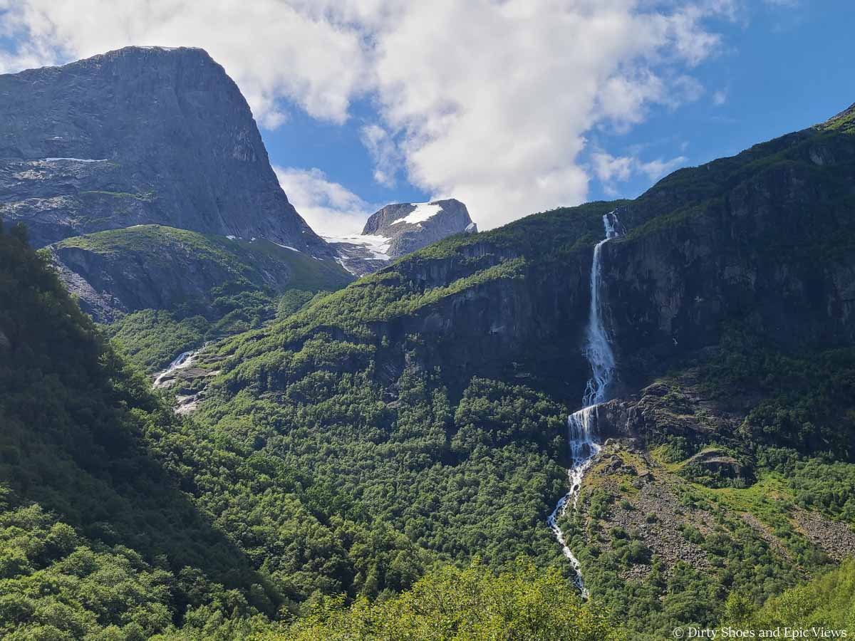 Views of mountains and a large waterfall from the Briksdal Glacier trail in Norway