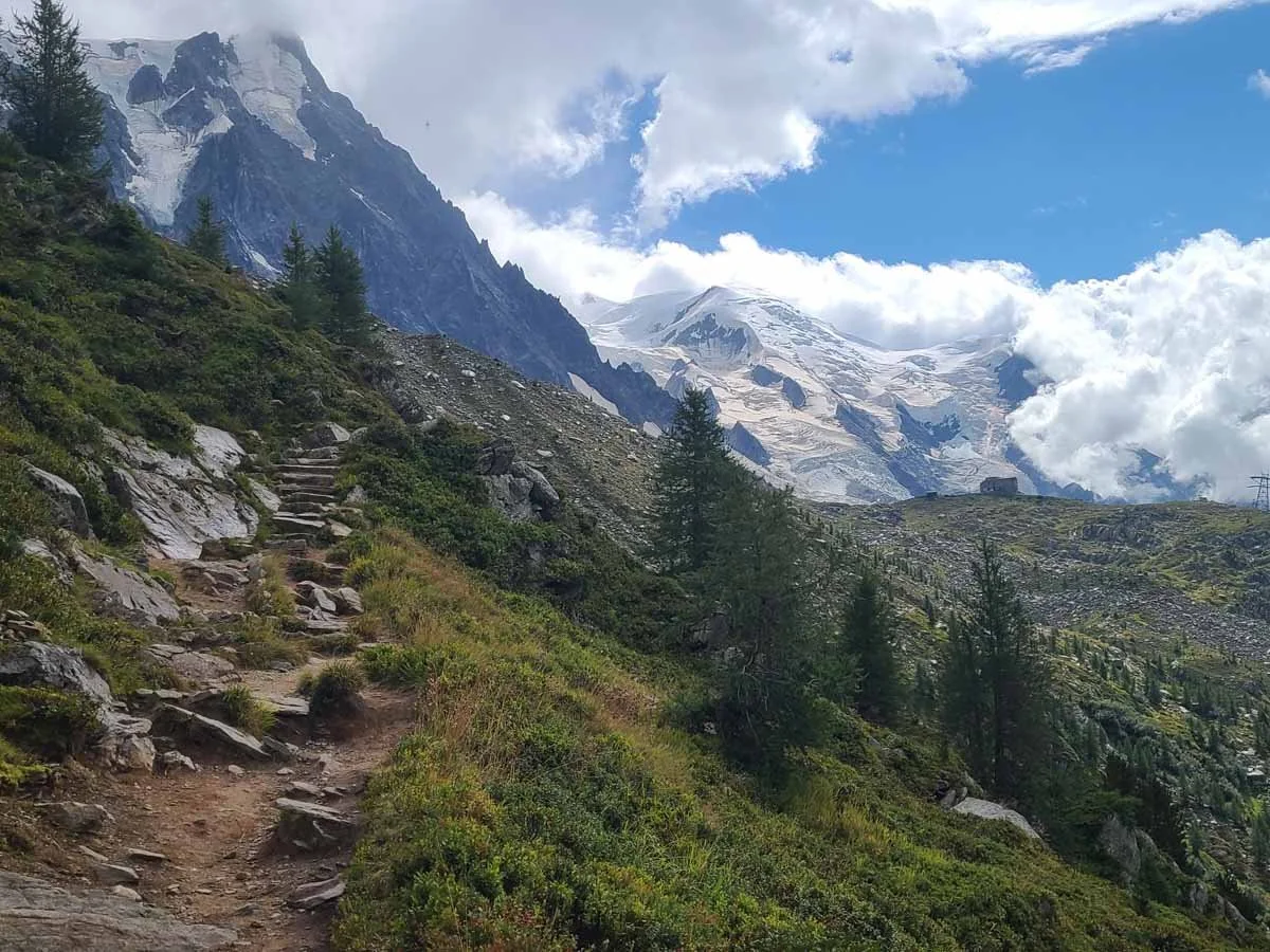 A stone staircase on the Grand Balcon Nord sits in front of views of Mont Blanc