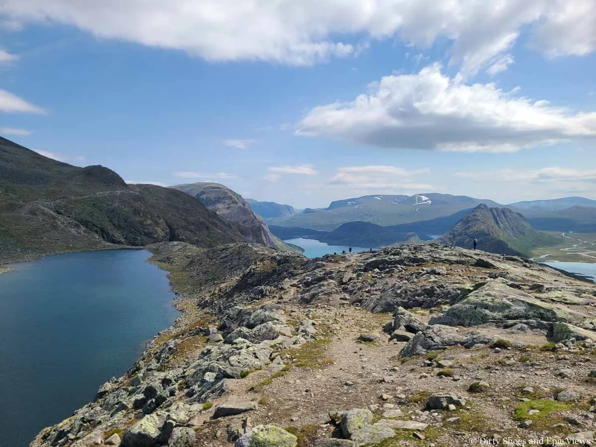 A narrow ridge runs down to a lake shore on the Besseggen Ridge trail in Norway