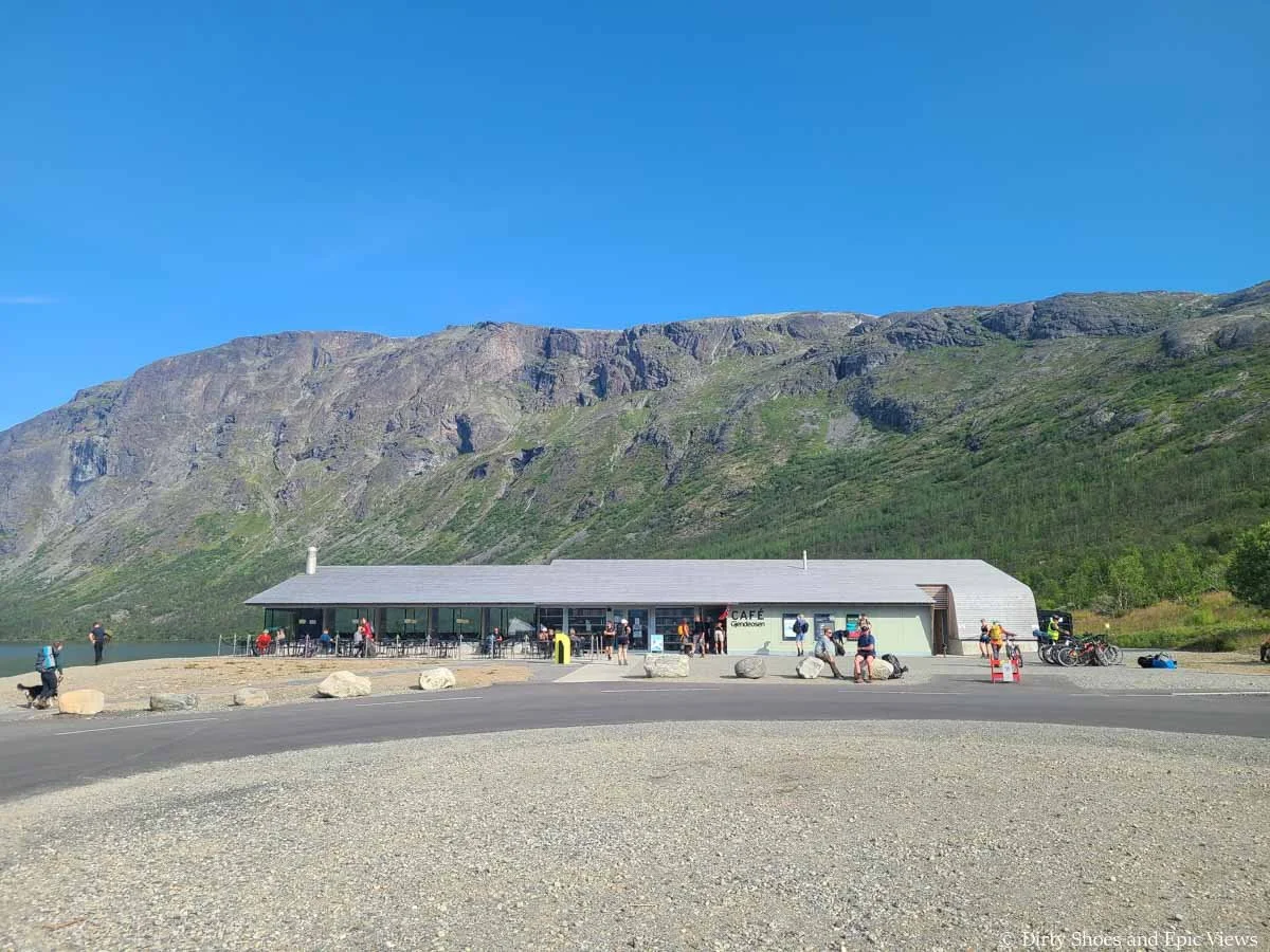 A cafe sits in front of mountain views at the start of the Besseggen Ridge trail