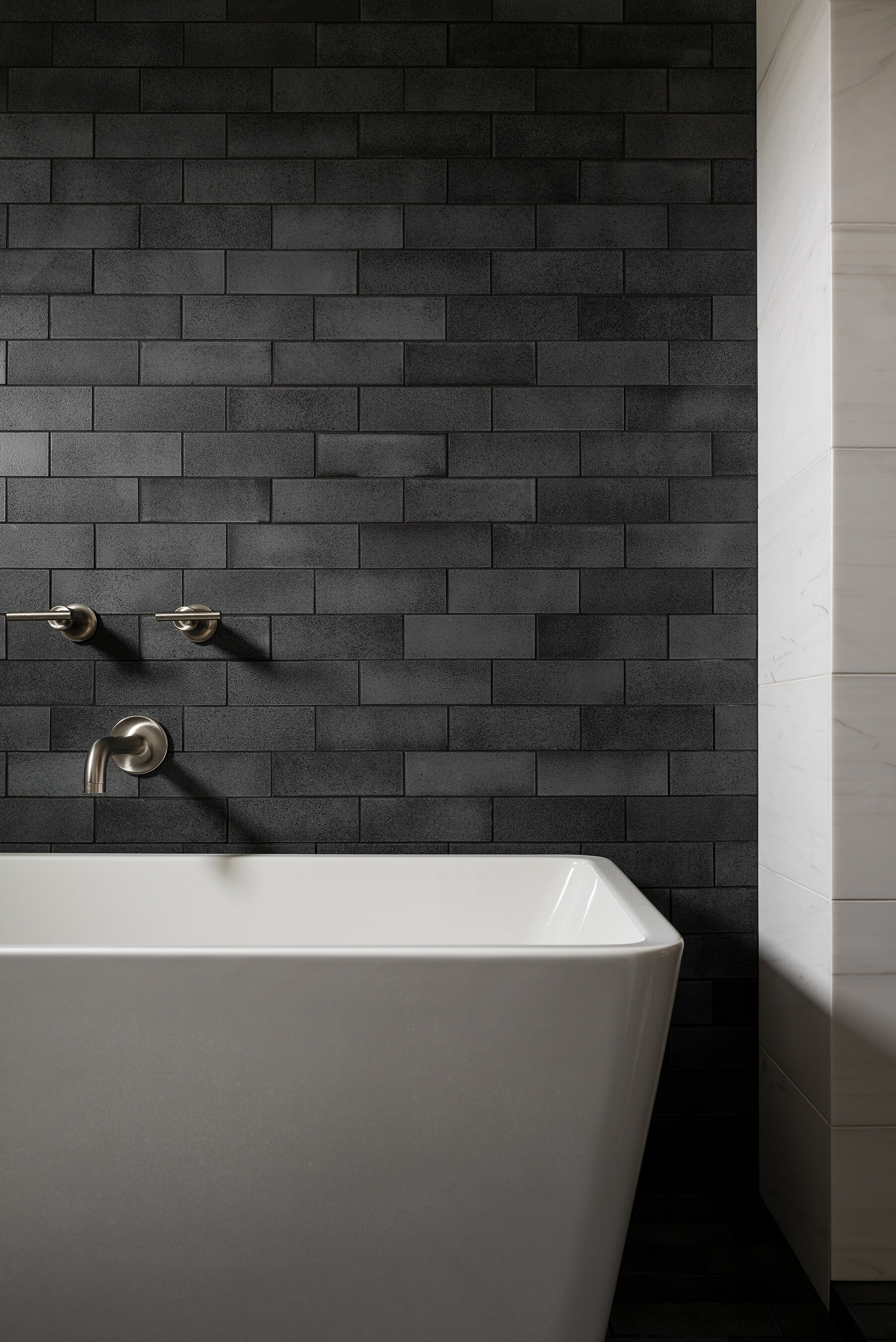 Black tile in bathroom shower walls