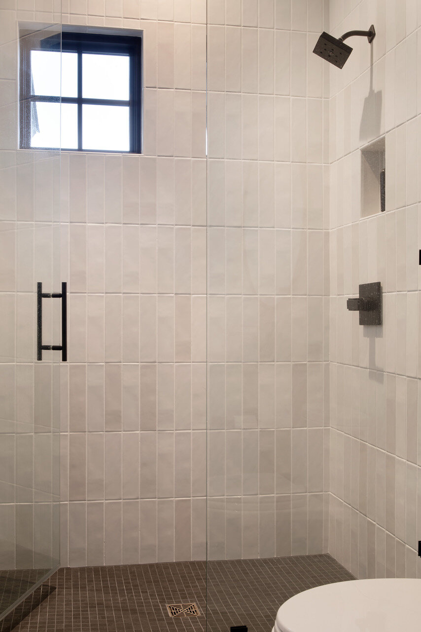 White stacked tile stand up shower