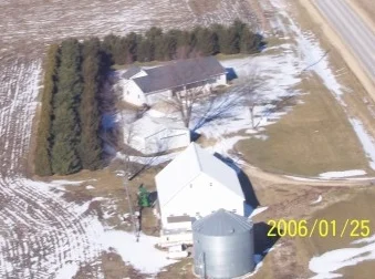 Here is a 15 year old windbreak that has Techny Arborvitae on the outside Spaced 8 ft apart in the row. 16 feet from the arborvitae is the White Pine spaced 16 ft apart. 16 feet from the pine is a row of Norway Spruce spaced 16ft apart in the row. At the present time this windbreak is giving excellent protection but looking back it would have been better to space them 4 feet farther apart in the row and between rows, better for the long term.