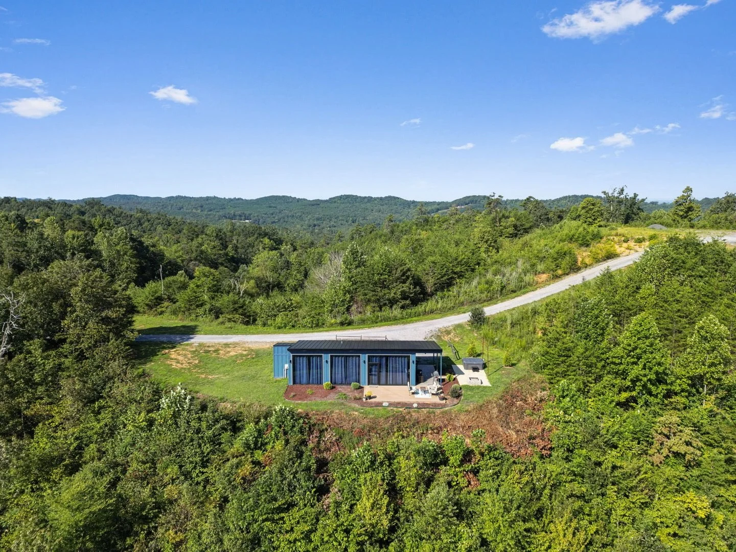 Wake up above the clouds at Cabin 4 
 Where floor-to-ceiling windows bring the mountains right into your living room and every moment feels like a getaway.

Soak in the hot tub, sip coffee on the deck, and unwind with unbeatable views of the Cherokee