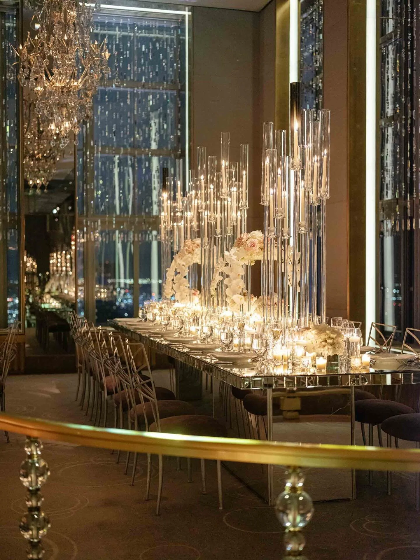 In honor of Joyce and Andreas&rsquo; anniversary, we&rsquo;re dreaming of their twinkling wedding suspended high above the city at the iconic @rainbowroomnyc, where we brought old New York glamour to life. Layers of glass, mirrored light, and cascadi