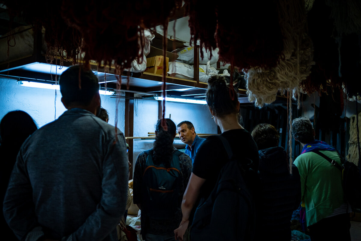 The carpet shopkeeper shows us the vegetables he uses to die the yarn. This carpet weaving business has been in their family for three generations.