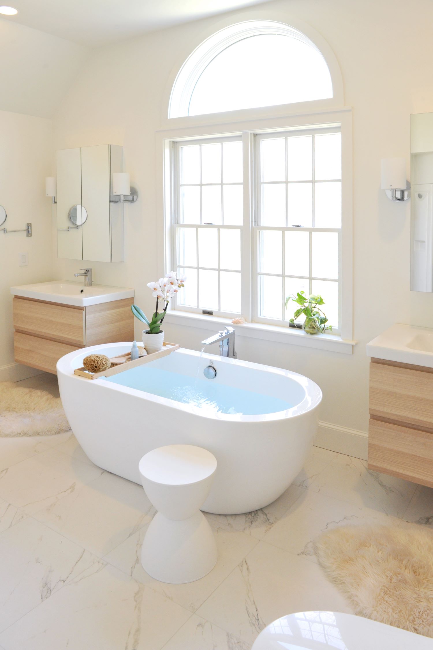 Luxury master bathroom renovation with standalone bathtub