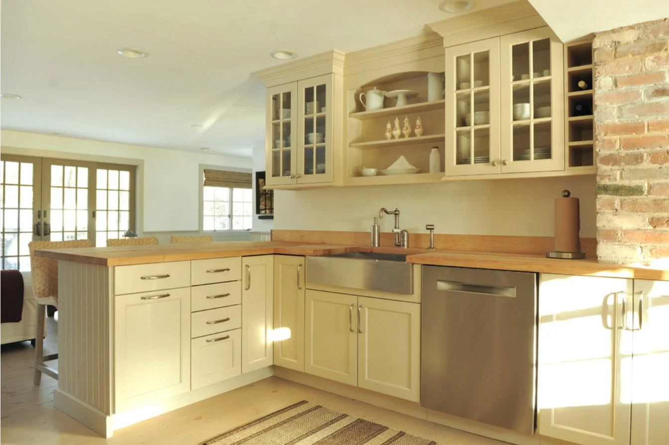 Renovated kitchen with brick chimney