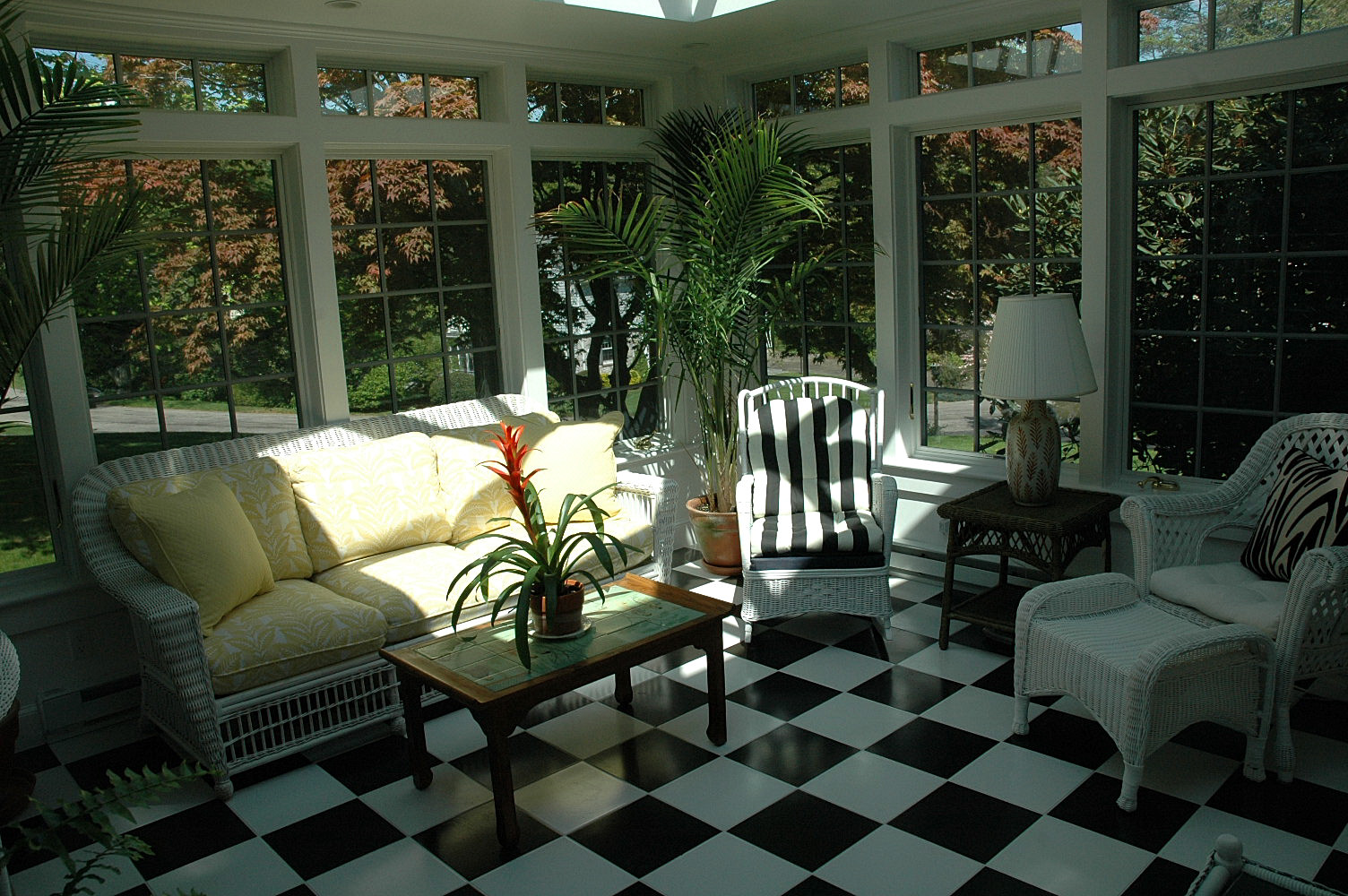 glass conservatory with checkerboard flooring
