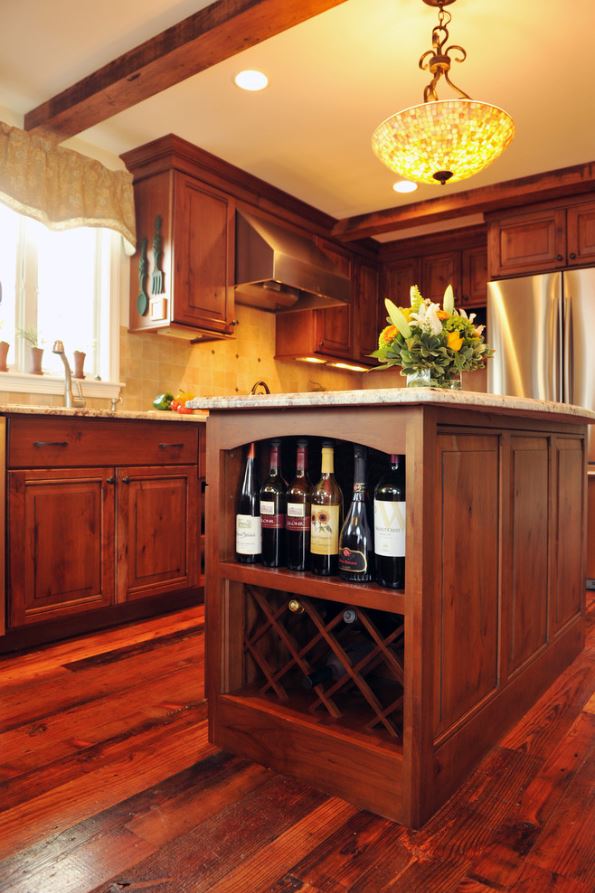 dark wood kitchen island with built in wine rack