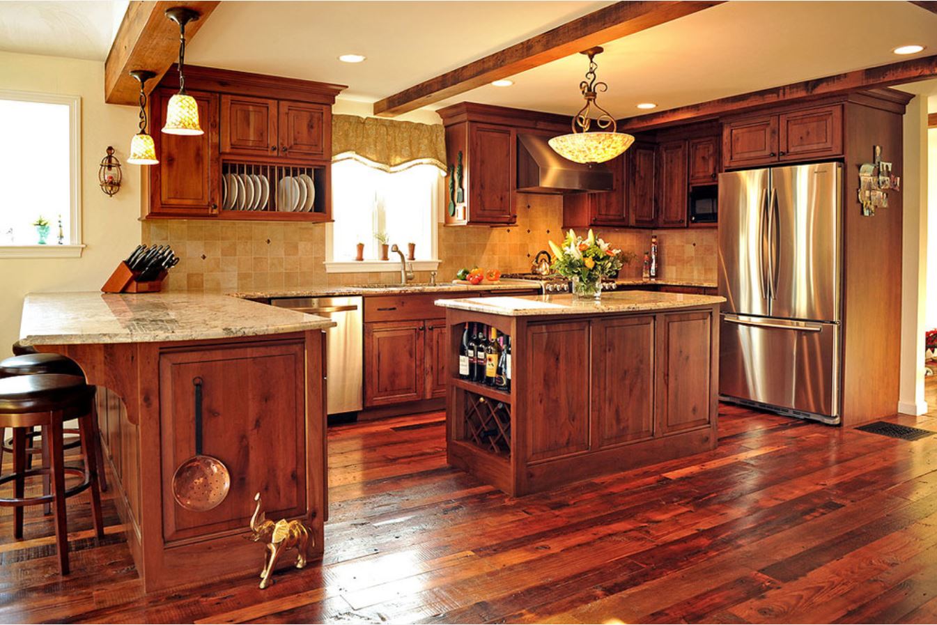 beautiful kitchen renovation with dark hardwood floors and cabinets