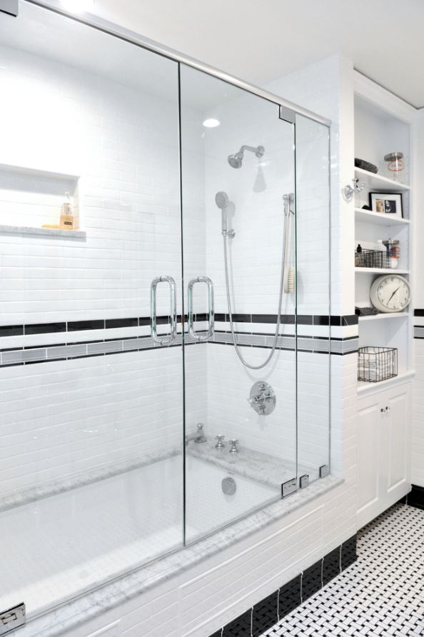 glass door shower with subway tile