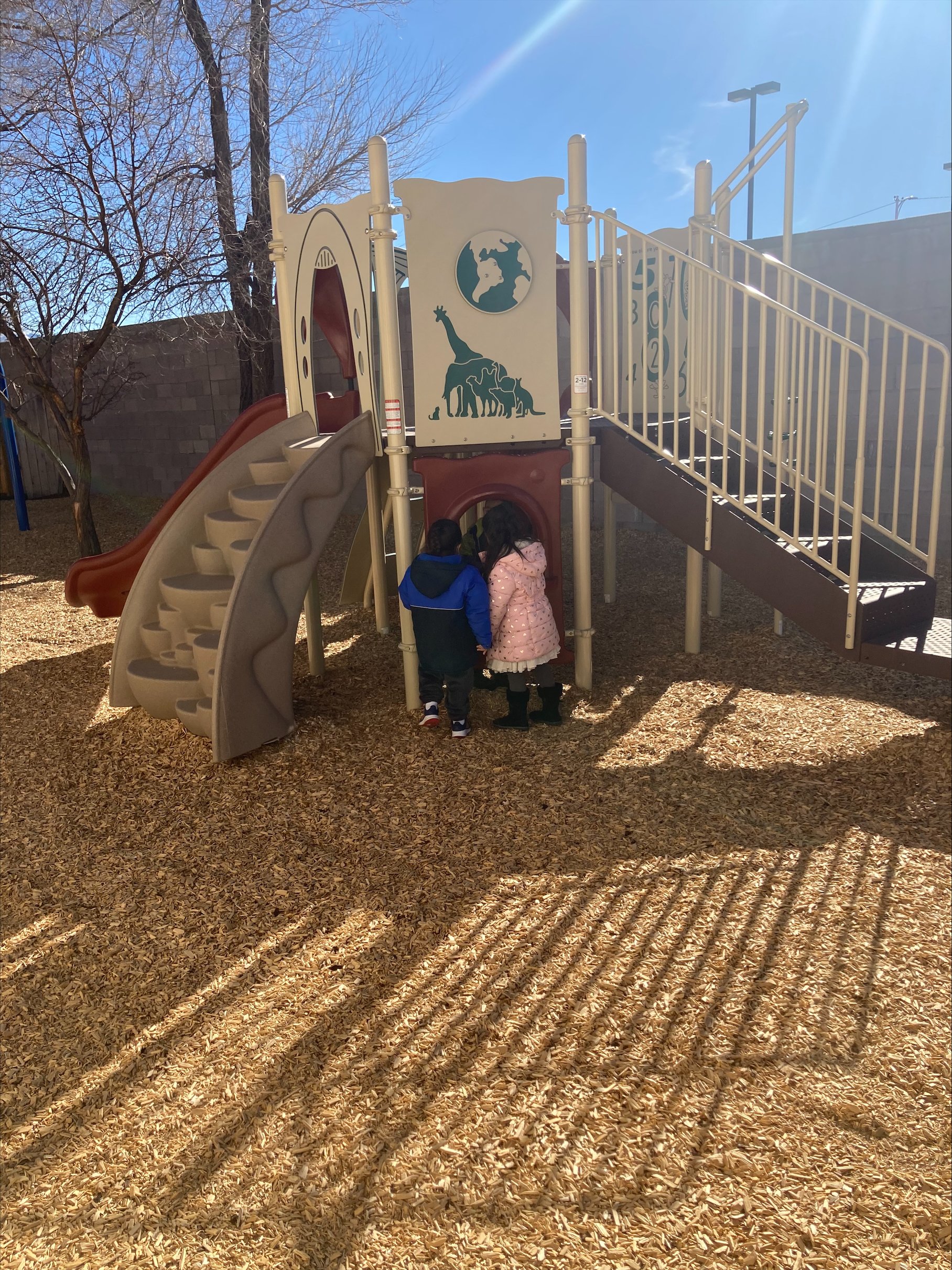Students playing with new playground equipment