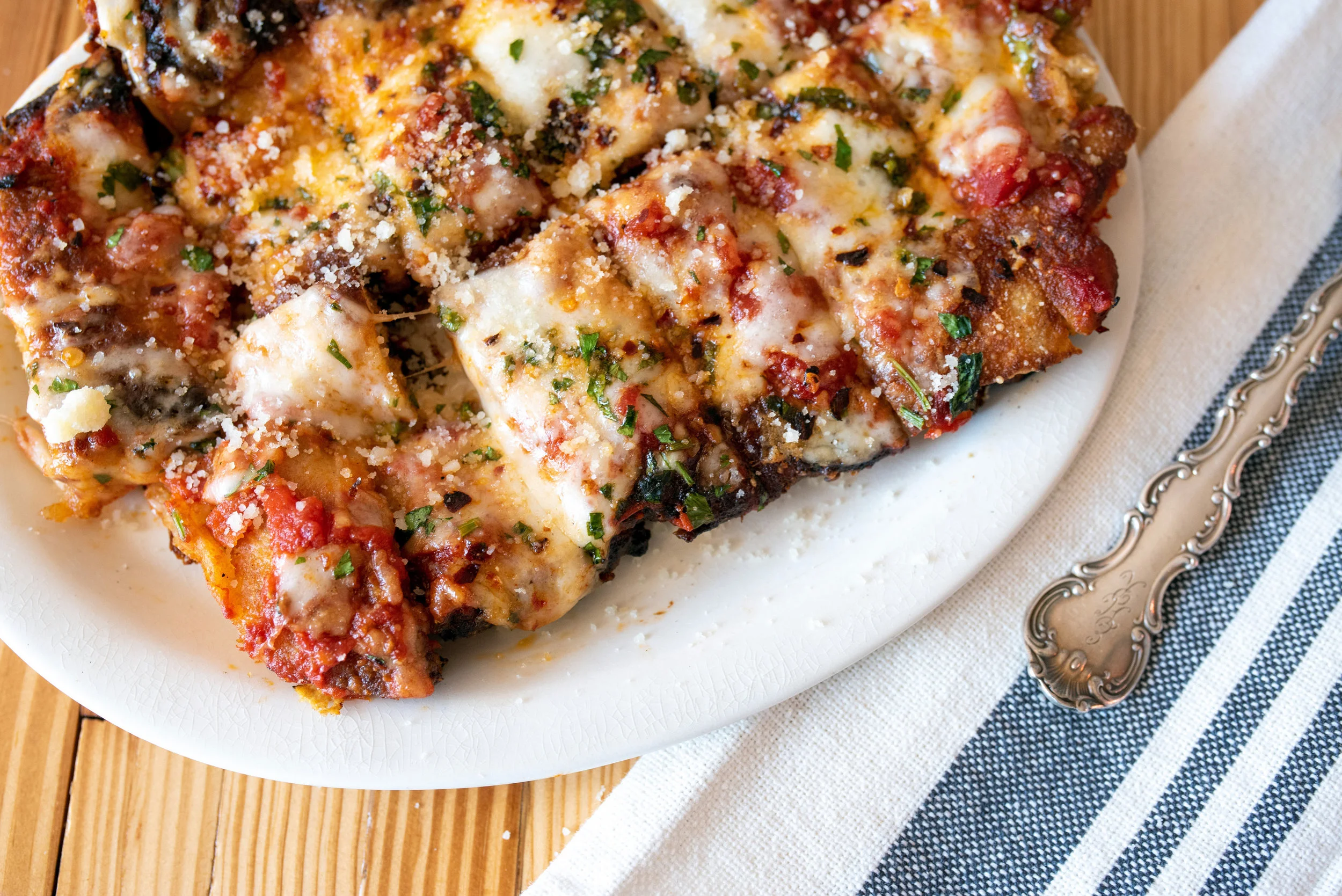 Sourdough fry bread topped with our Bolognese, mozzarella, parsley, and finished with ground Grana Padano. A seasonal small plate.