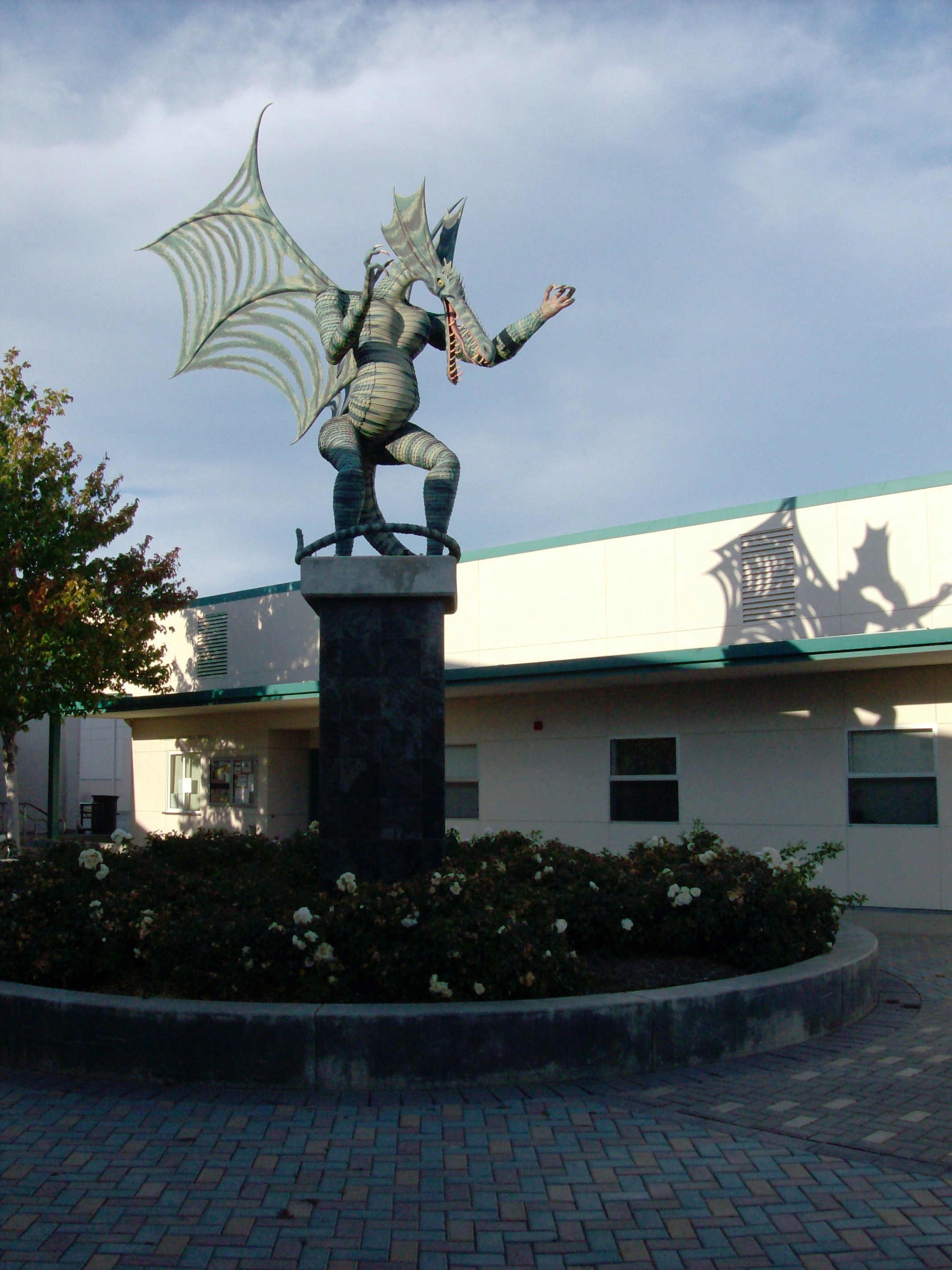  Sonoma Valley High School Dragon mascot stands on a twelve-foot high pedestal in the center of Chet Sharek Plaza, boldly guarding the campus entrance 