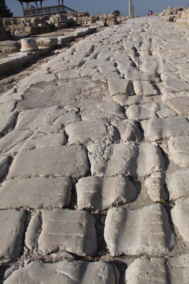 Fig. 2.35: Roman road in Sepphoris. 1st century CE. The wagon wheel ruts are still prominent. Roads varied widely with regard to quality and straightness, but each one increased local range of trade.