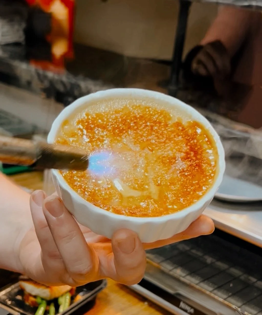 Chef torching the house-made crème brûlée.
