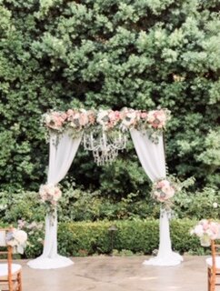 Drape, Chandelier and Flower Arch $250
