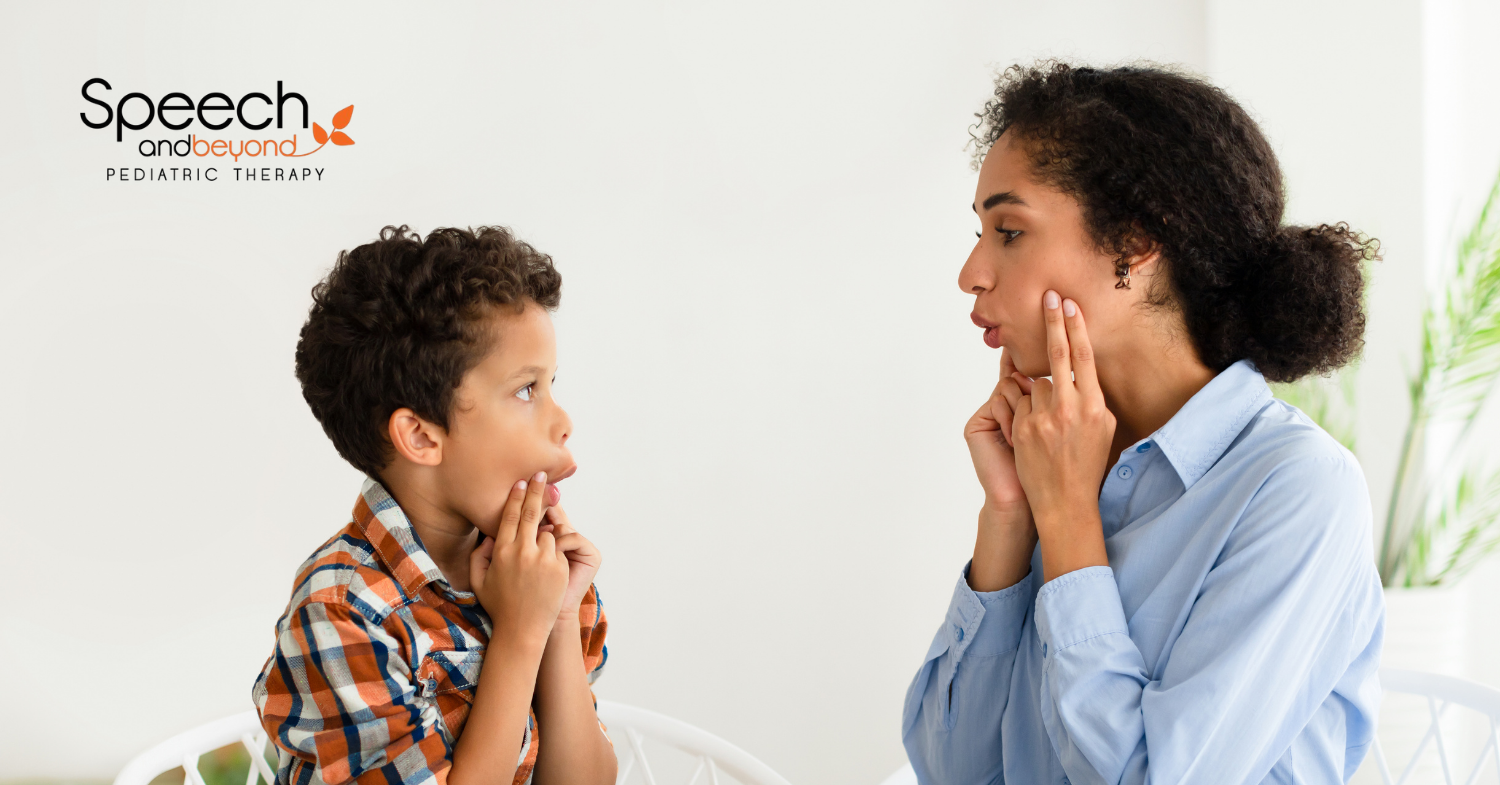 a child looking at an adult and mimicking her mouth and hands on cheek