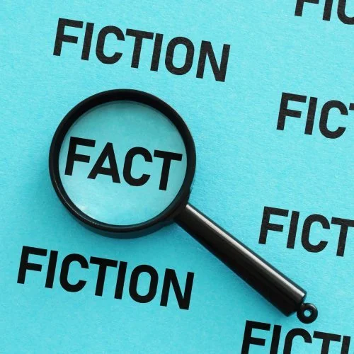 Magnifying Glass over the words Fact and Fiction