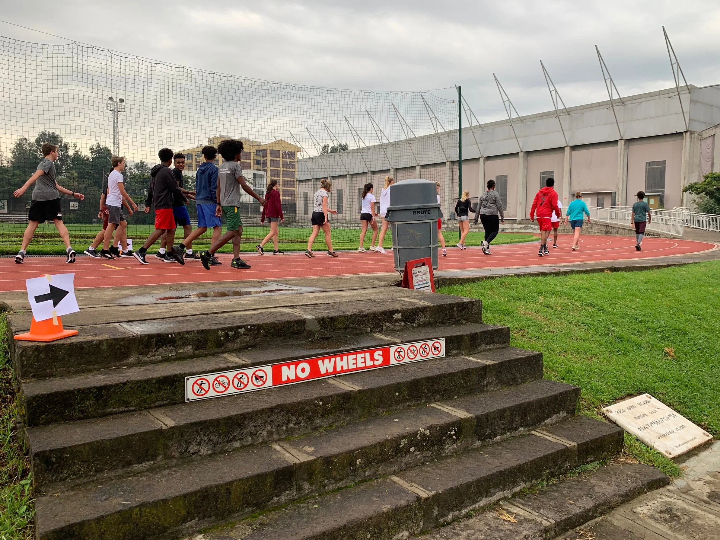 Warming up for tryouts at the ICS track.