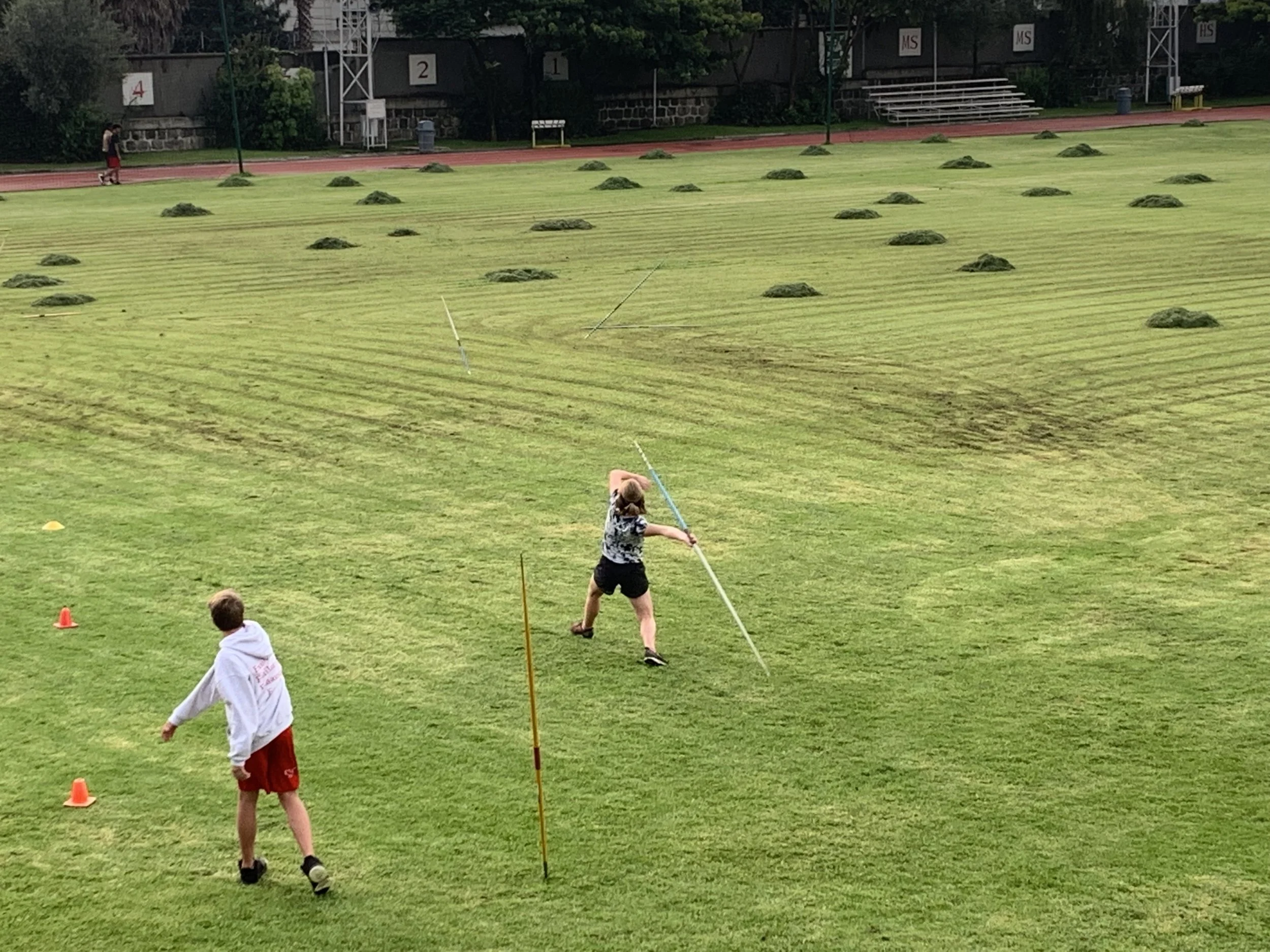 The view of practice from the parents viewing platform. The wind-up shown above. Followed by the throw below.
