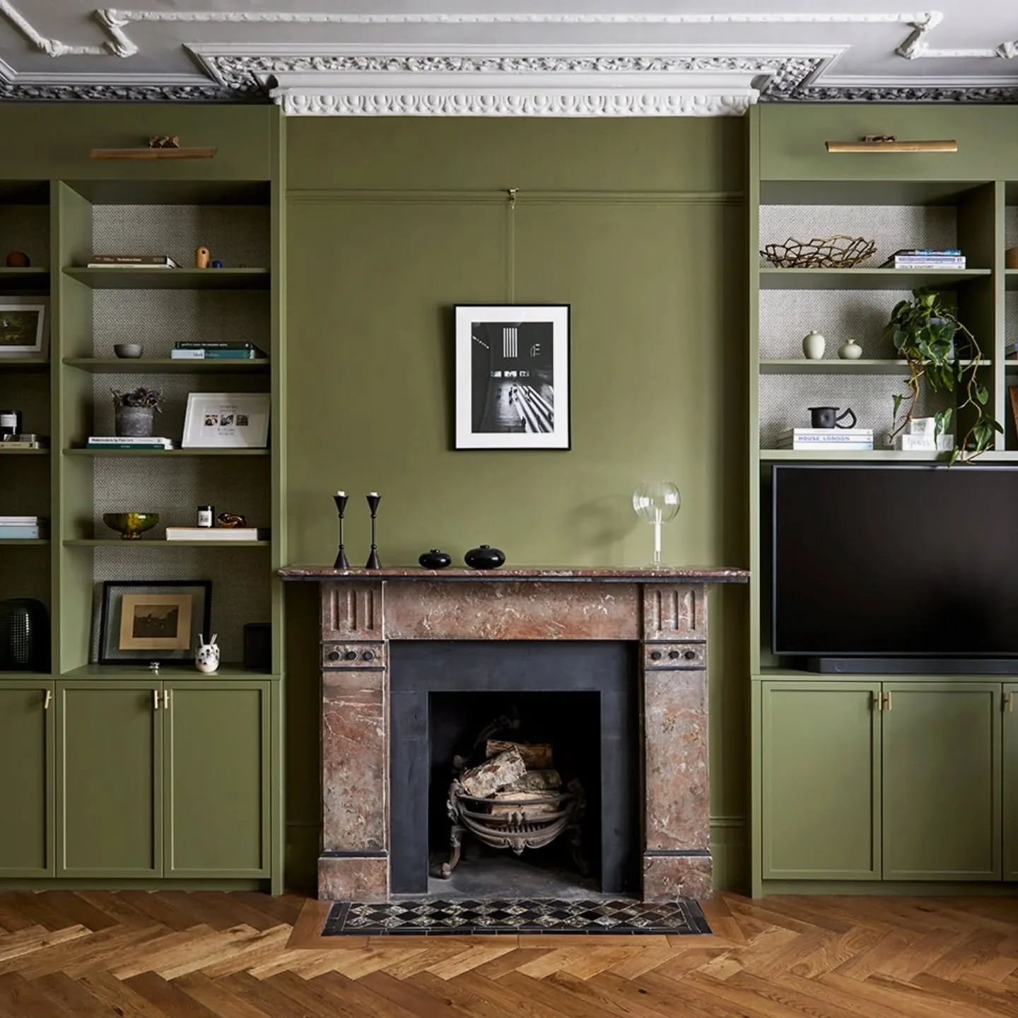 At Huron Road Residence, we put in this new herringbone flooring and used a warm green tone to bring out the stone colors of the original fireplace.

@annastathakiphoto @pace_projects_london @tedtoddfloors @rokosdesign @jon.grant 

#bespokecabinetry 