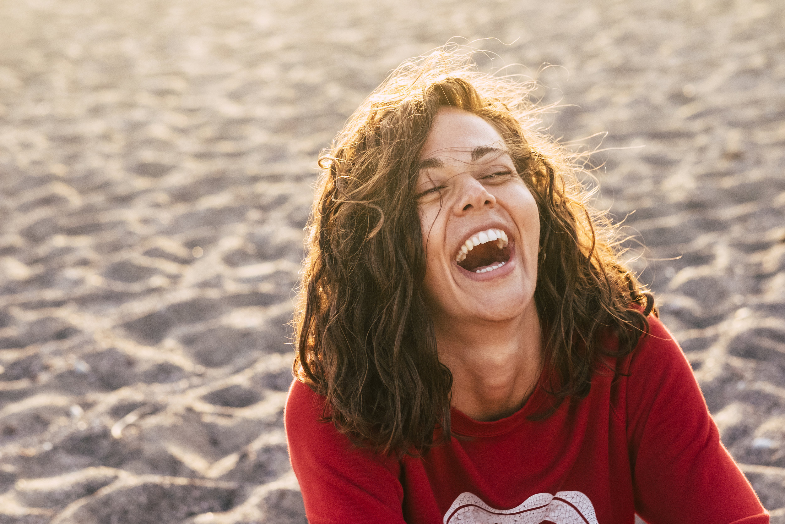 Girl Laughing on Beach