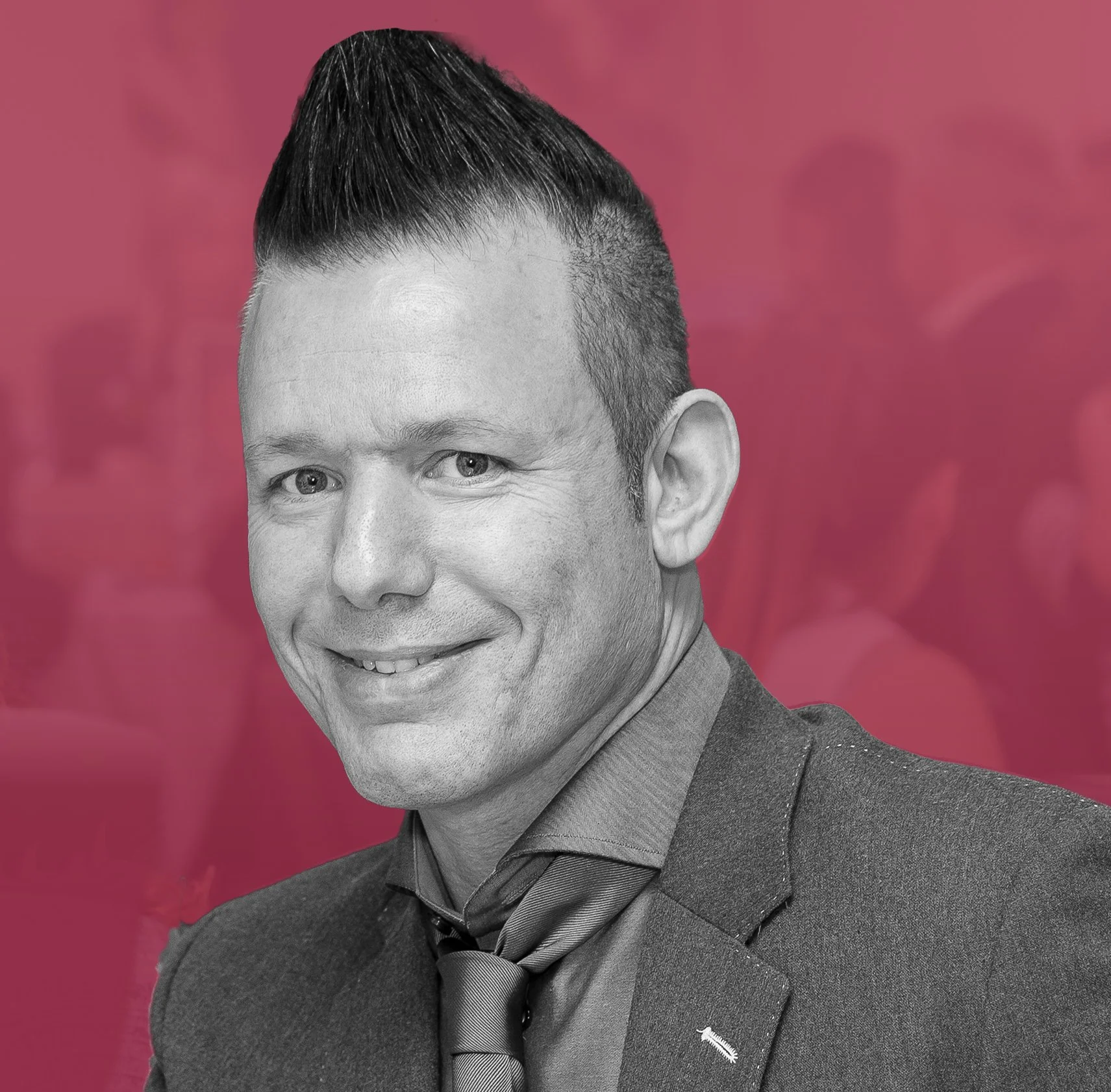 Lee Myers, Partner at Zefyr Consulting, smiling at camera with a pink overlay background.