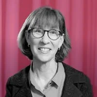 Ellen Schmidt-Devlin, Partner at Zefyr Consulting, smiling at camera with a pink overlay background.