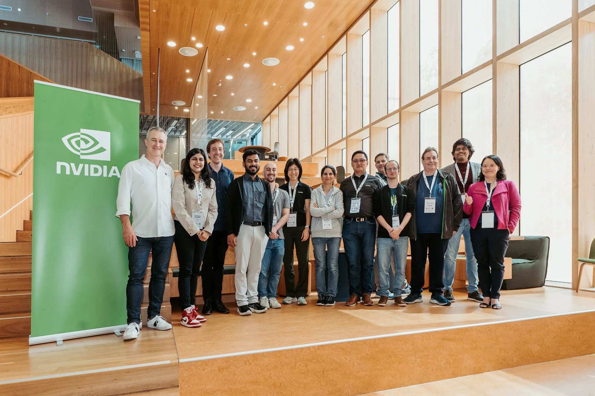 People standing next to NVIDIA sign