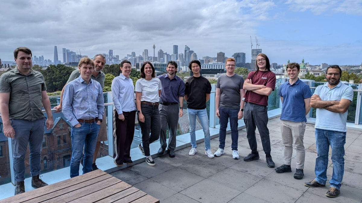 People standing on balcony with cityscape background
