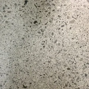 MEDIUM AGGREGATE EXPOSURE Mainly 1/8″ to 1/4″ aggregate, with paste and large aggregate randomly exposed.