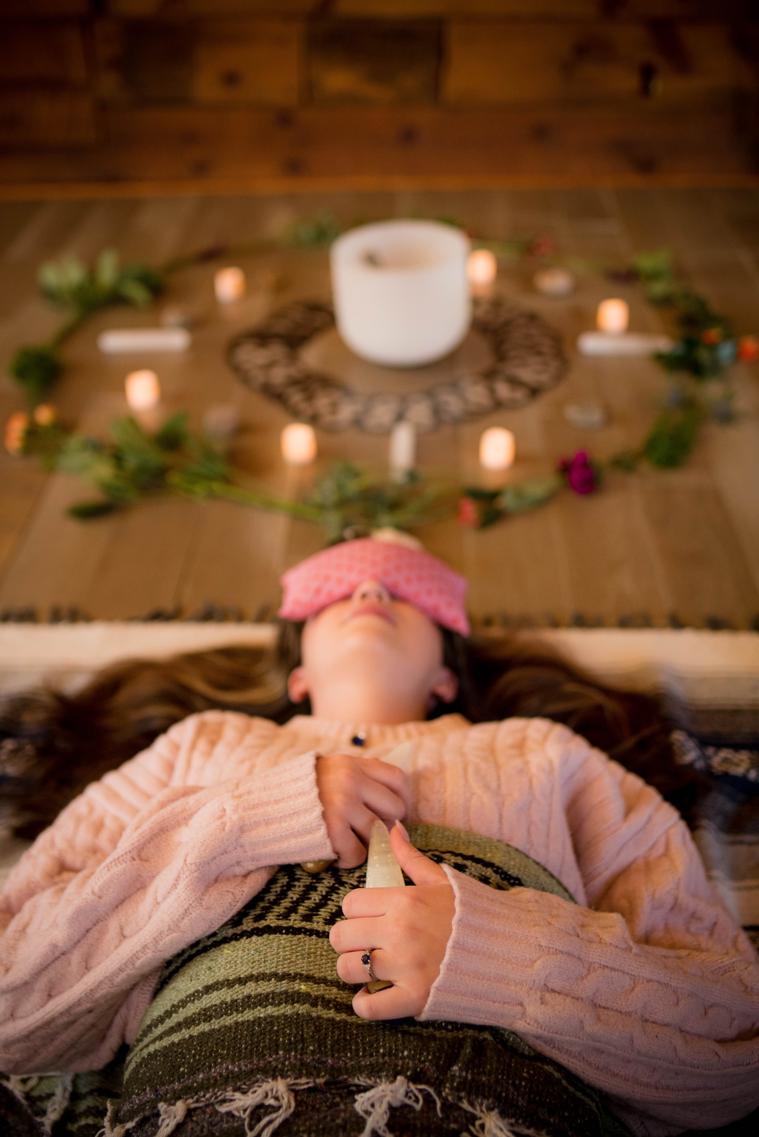 Woman leader breathing deeply in a calm, modern therapy space at Transform the Nest
