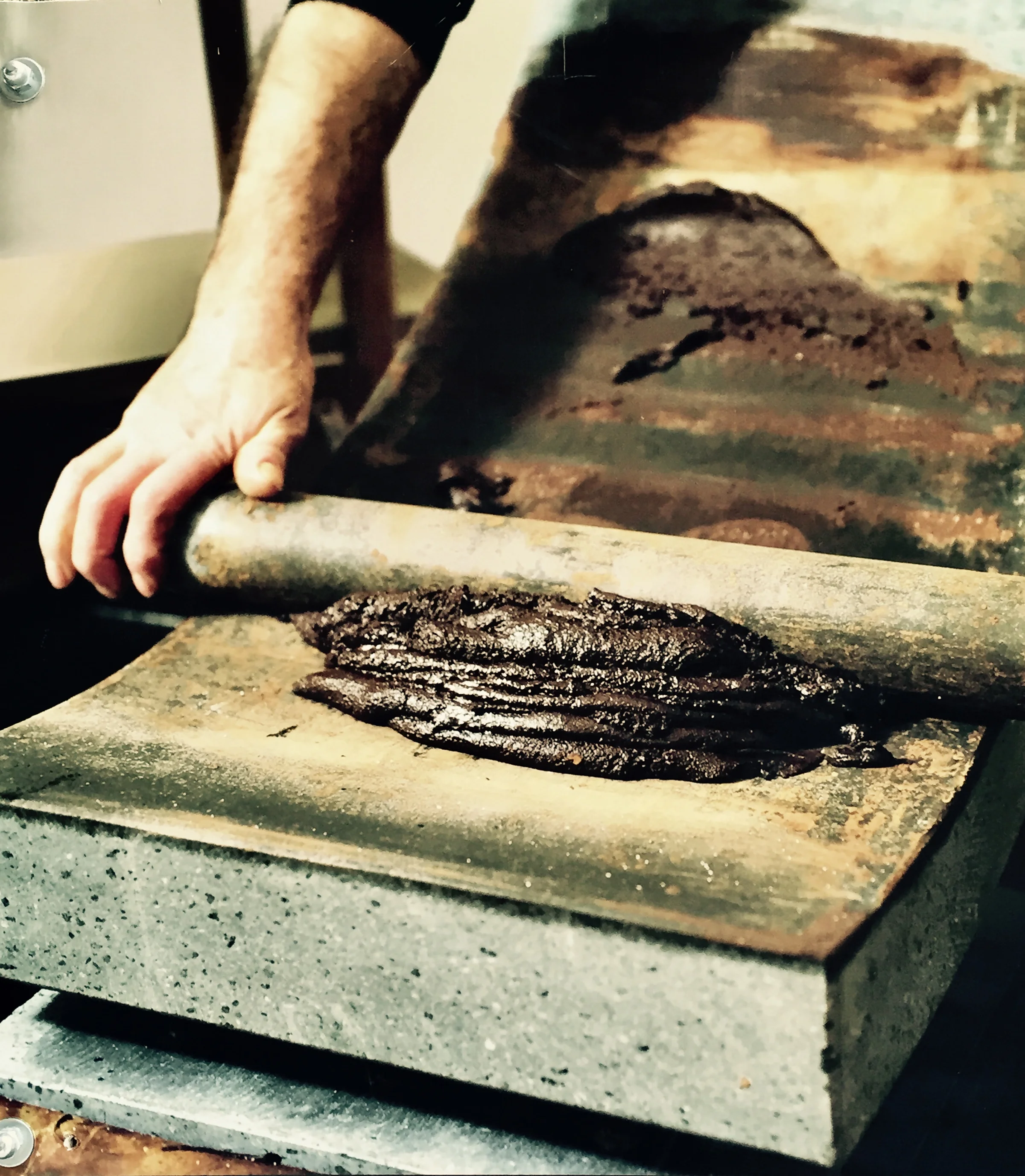 Matete used to hand grind cocoa beans for making chocolate