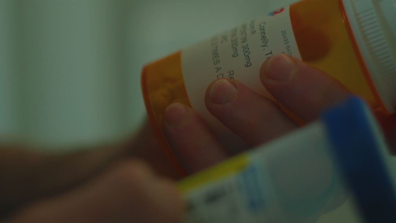 Tristan Connelly shows pill bottle