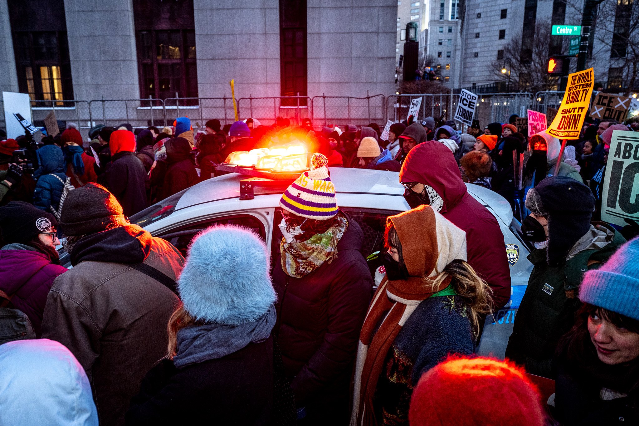 Police car overwhelmed by protesters near ICE detention center NYC January 2025