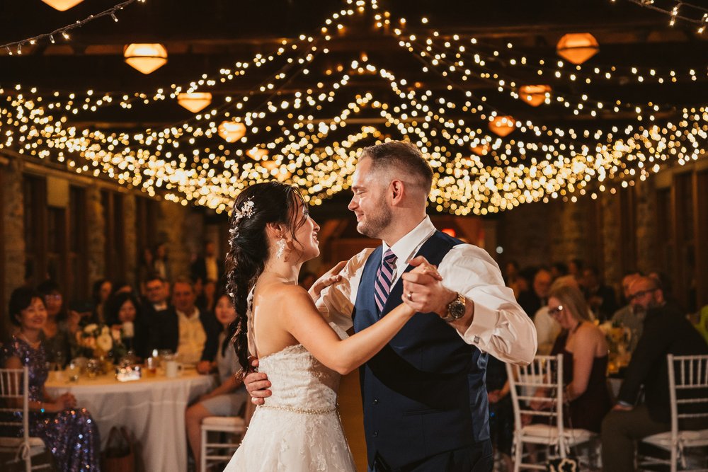 newlyweds-first-dance-under-string-lights.jpg