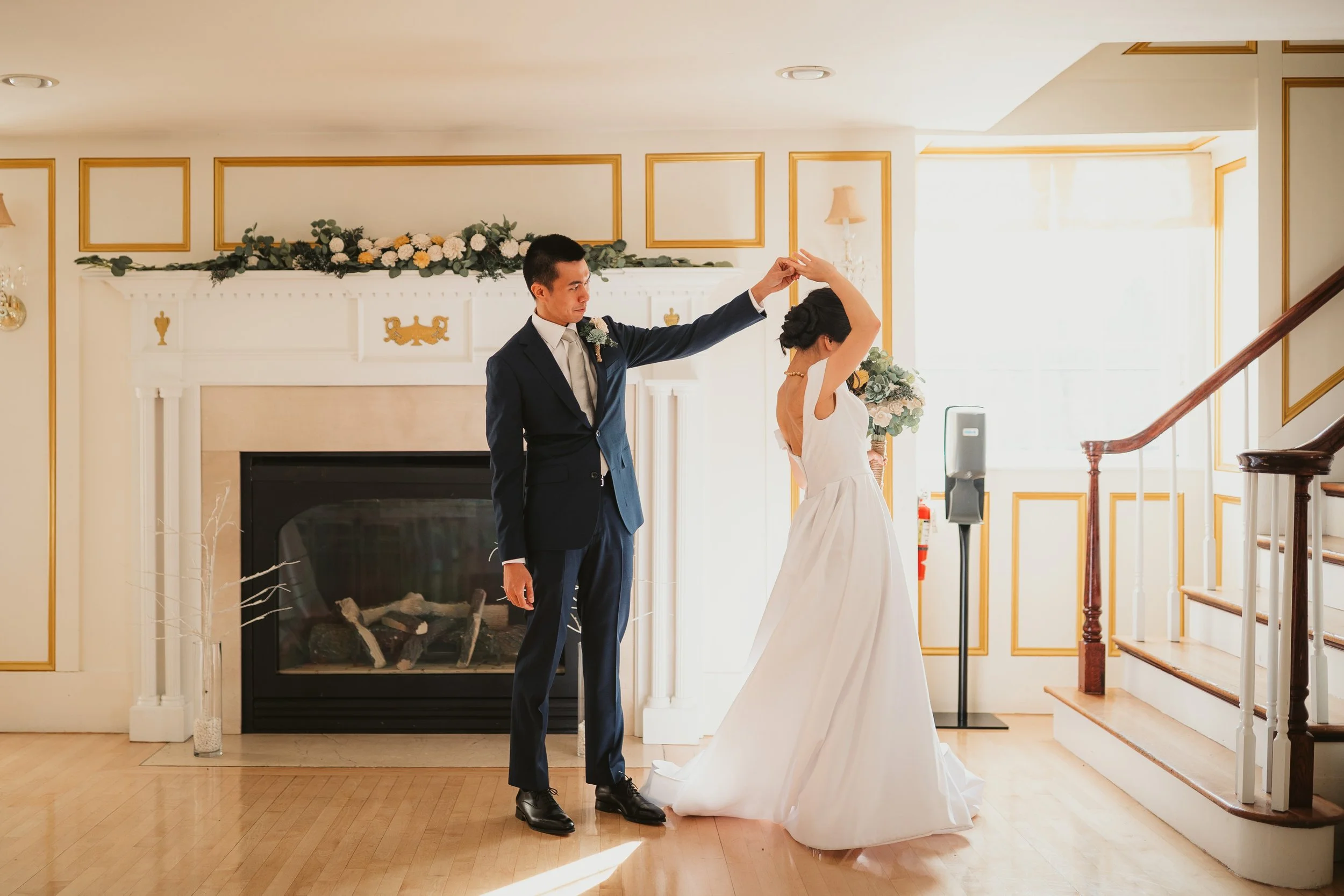 bride and groom first look by the fireplace