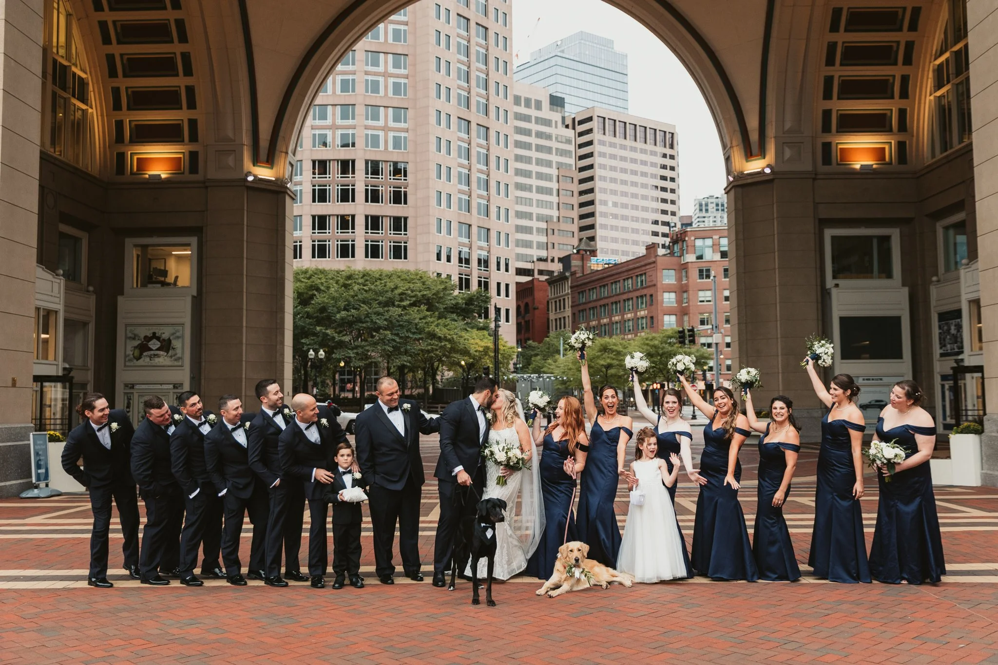 Bridal party portraits under the Boston Harbor Hotel archway in Boston