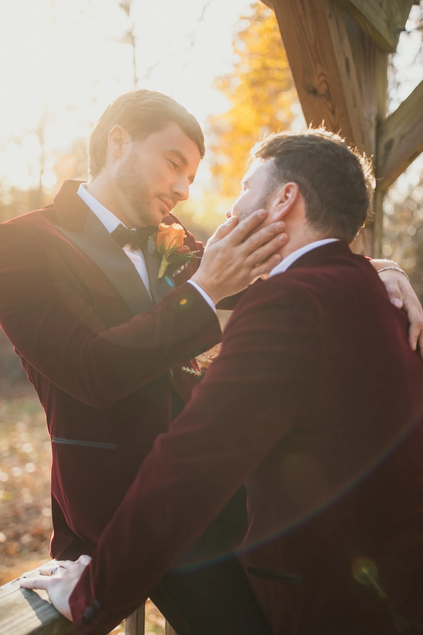 Two grooms share an intimate golden hour portrait at Stevens Estate at Osgood Hill in North Andover, Massachusetts.