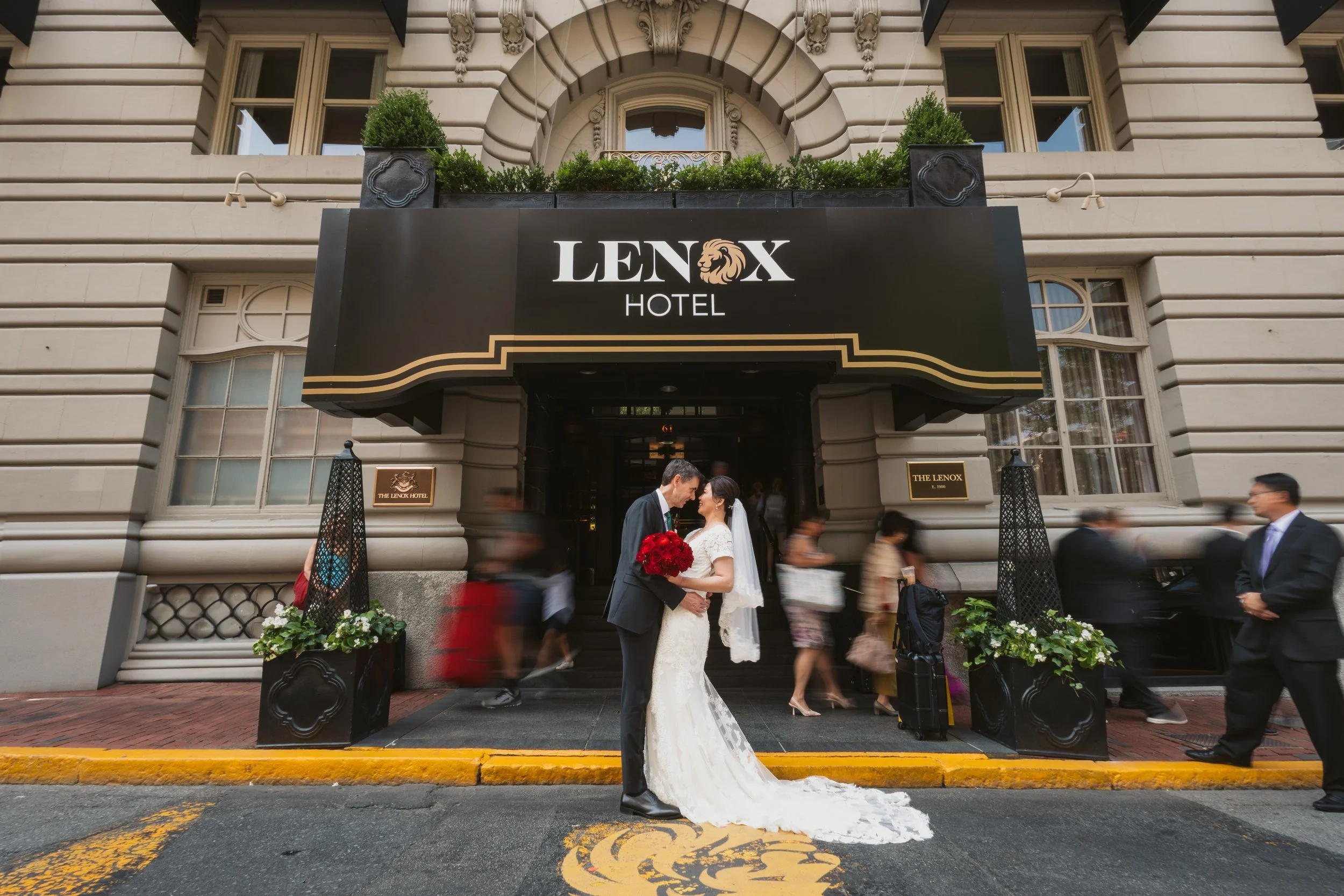 Hotel front door bride and groom portrait