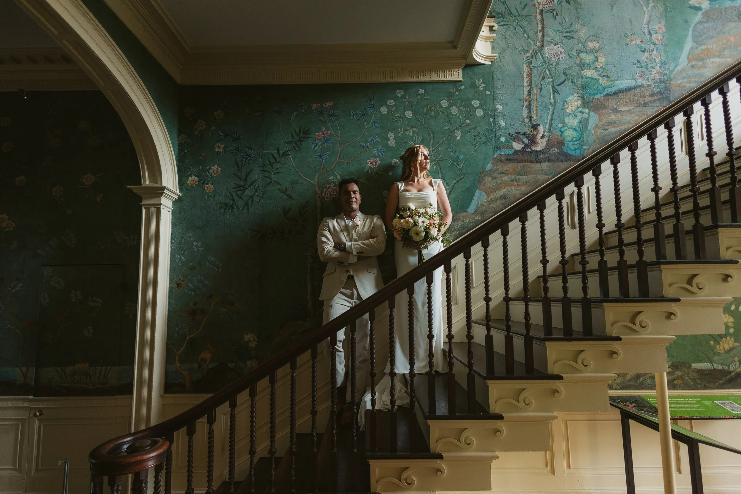 staircase wedding portrait with painted wallpaper