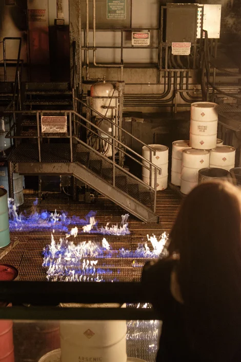 63A stage set with fire seeping through grill.jpg