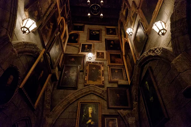 39B walls with many hung portraits.jpg